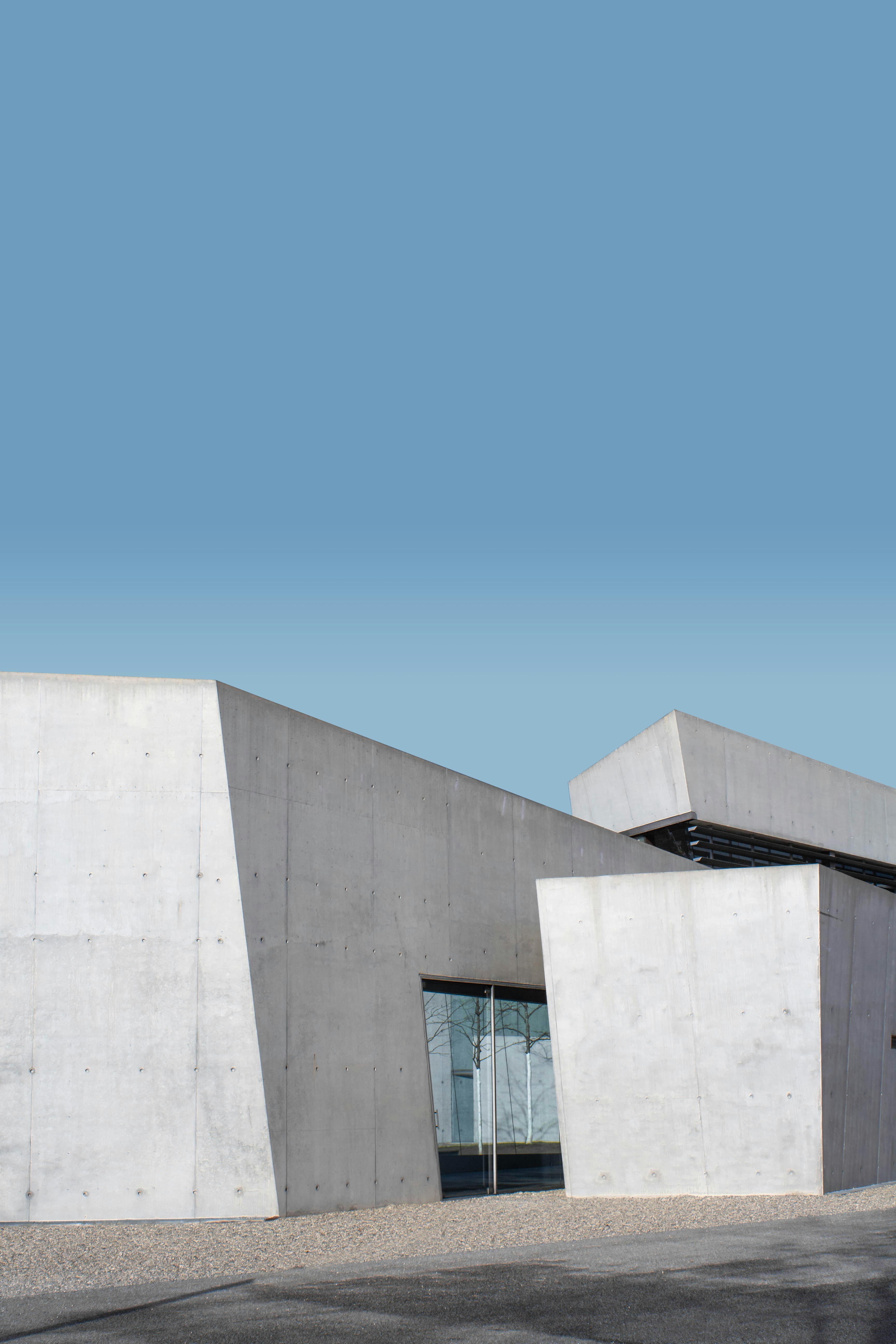 white concrete building under blue sky during daytime